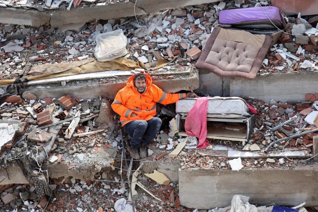 Heartbroken Father Sits Amid Rubble Holding His Dead Daughter's Hand Heartbroken Father Sits Amid Rubble Holding His Dead Daughter's Hand