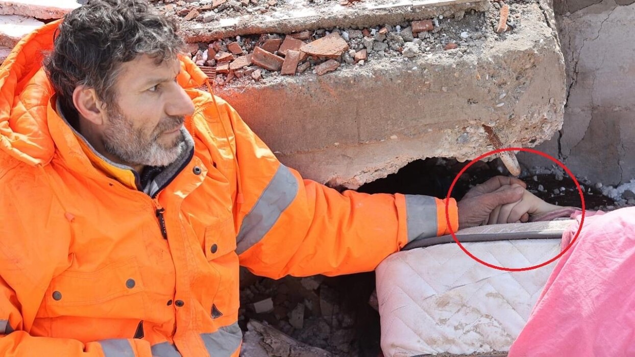 Heartbroken Father Sits Amid Rubble Holding His Dead Daughter's Hand Heartbroken Father Sits Amid Rubble Holding His Dead Daughter's Hand